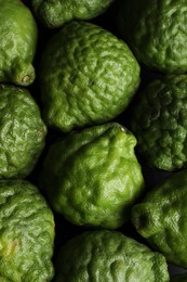 Photo of Fresh ripe bergamot fruits as background, top view