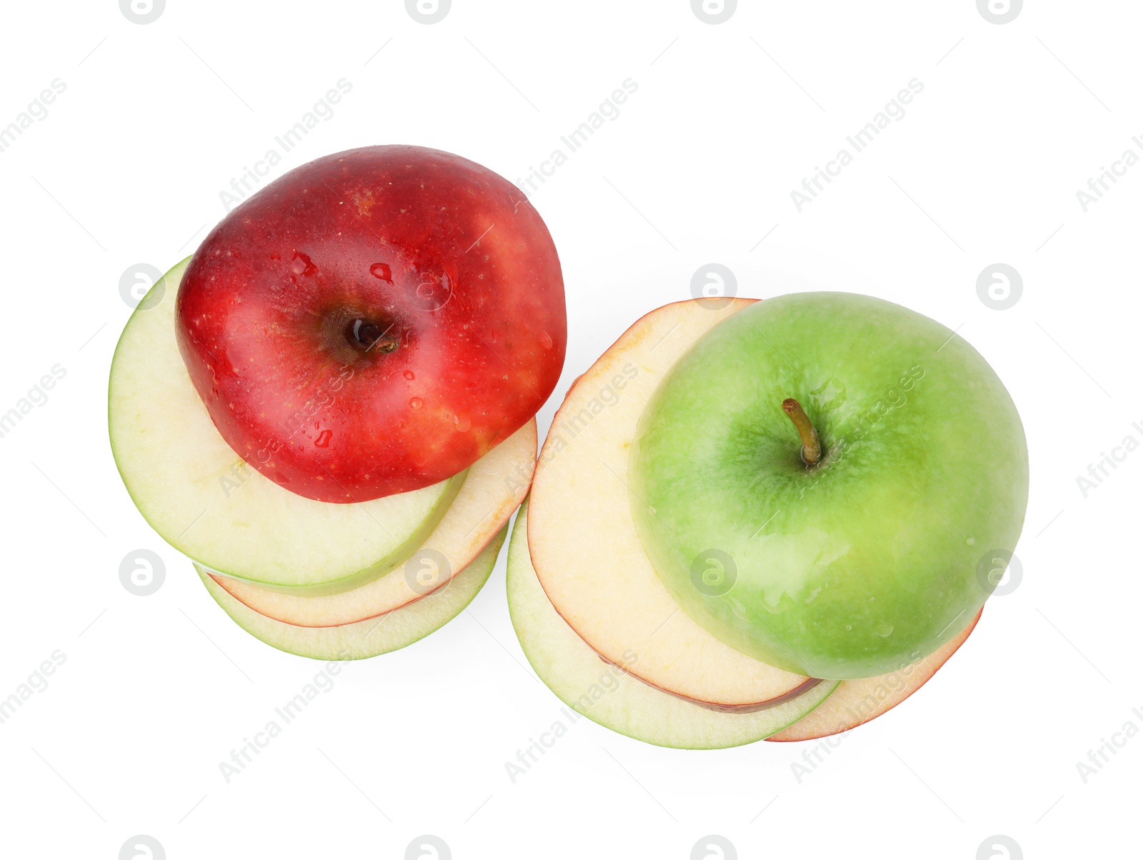 Photo of Slices of ripe apples isolated on white, top view