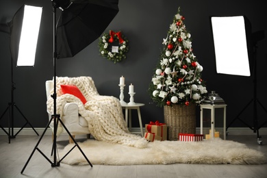 Beautiful photo zone with professional equipment and  decorated Christmas tree