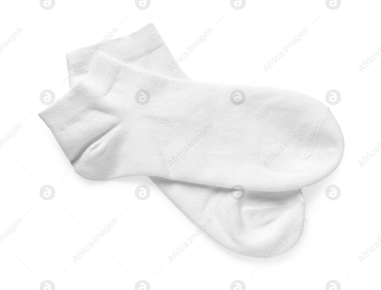 Photo of Pair of socks isolated on white, top view