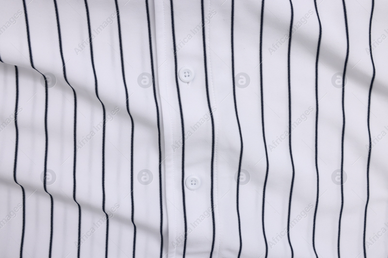 Photo of Striped baseball uniform as background, top view