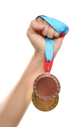 Woman holding medals on white background, closeup. Space for design