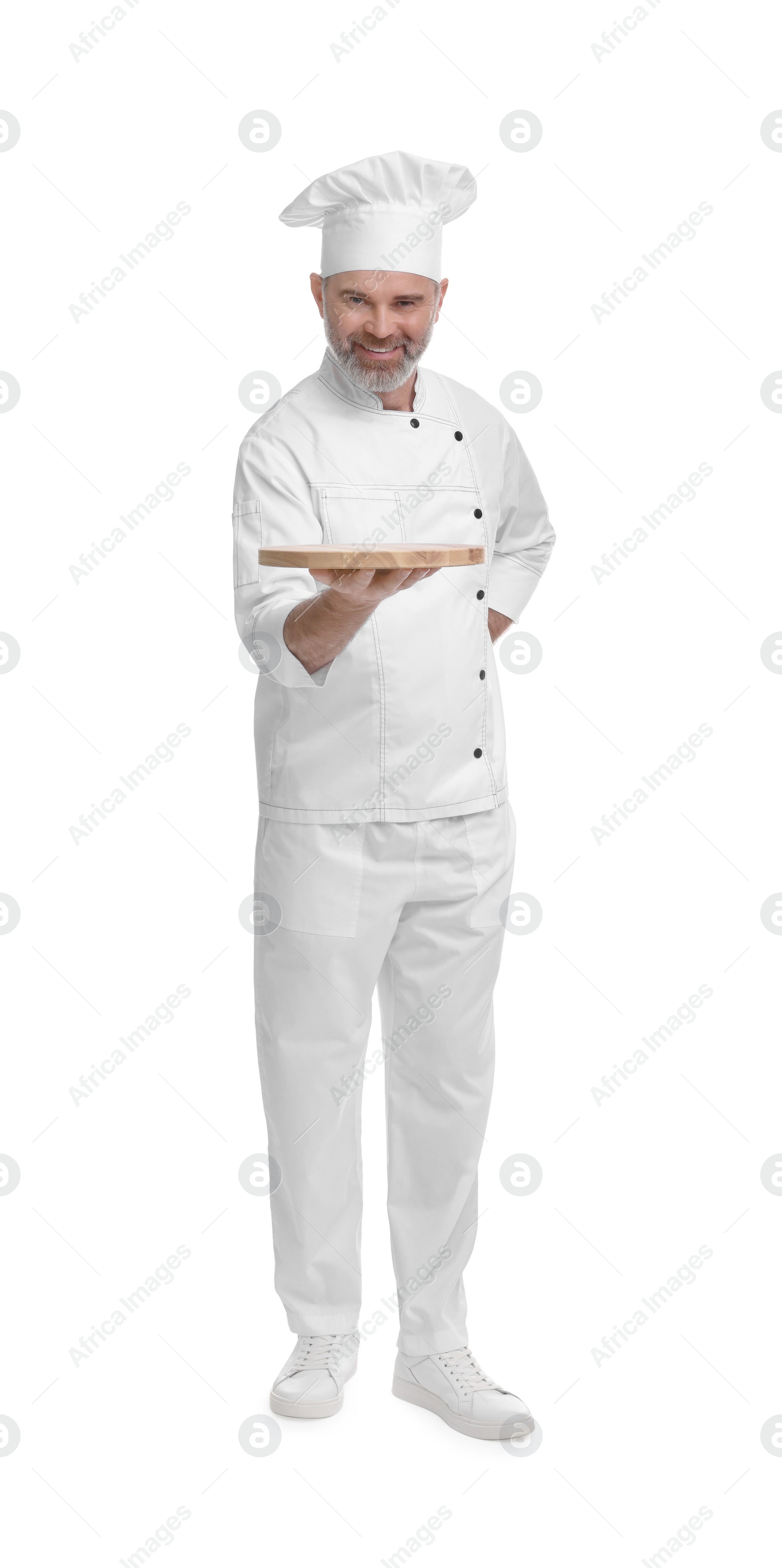 Photo of Happy chef in uniform with wooden board on white background