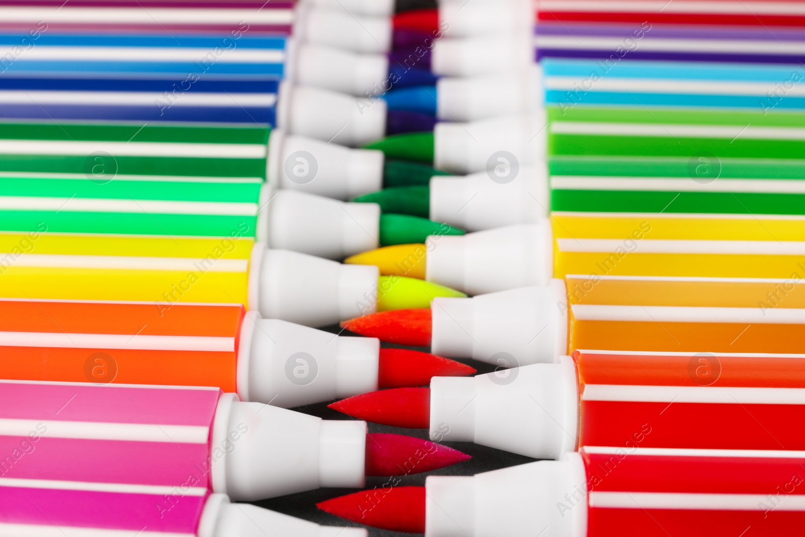 Photo of Many bright markers as background, closeup view