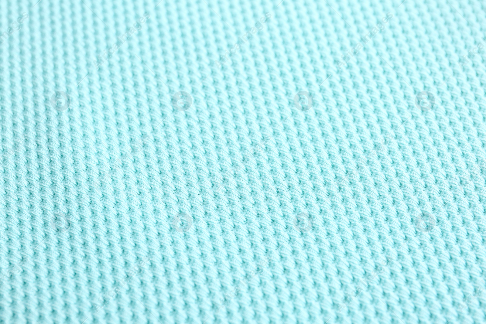 Photo of Textured light blue fabric as background, closeup