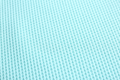 Textured light blue fabric as background, closeup