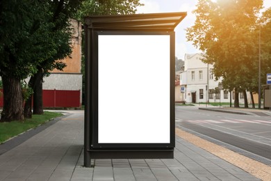 Photo of Advertising board on bus stop. Mockup for design