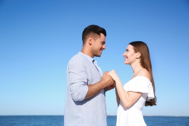 Lovely couple together on beach. Summer vacation