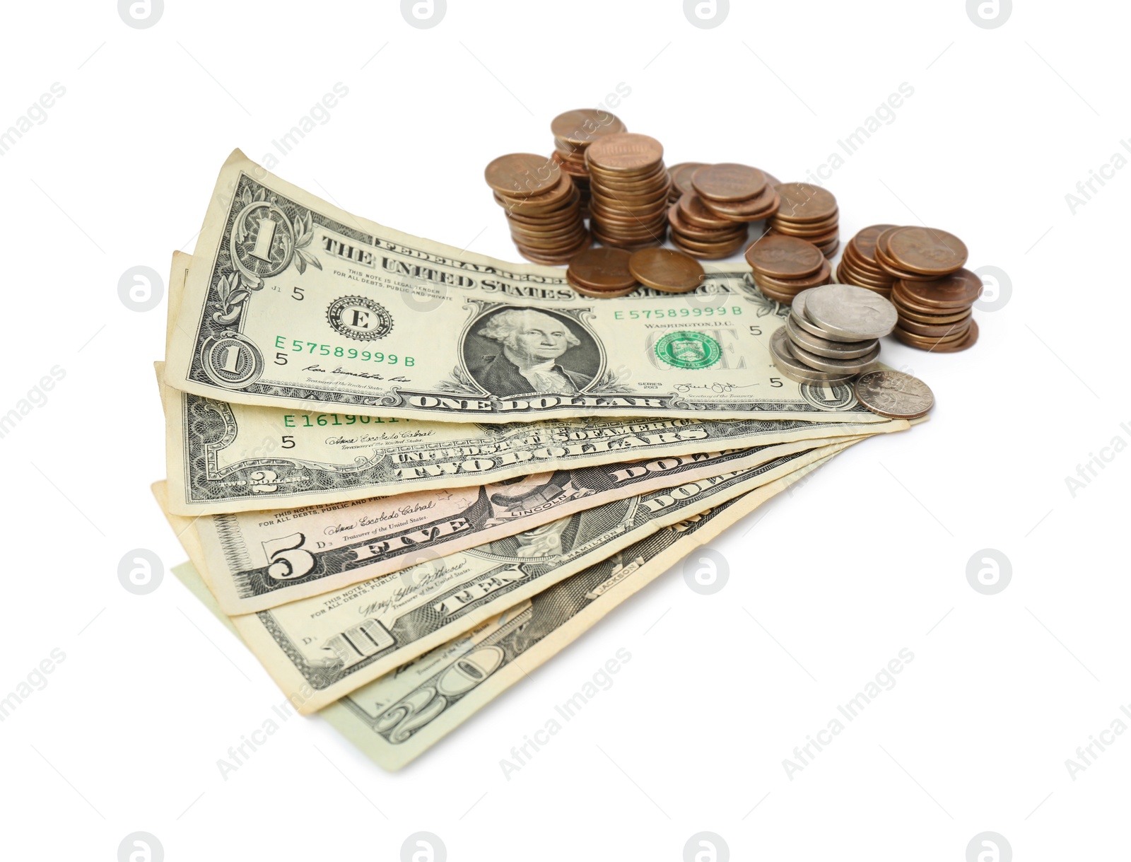 Photo of Dollar banknotes and stacks of coins on white background