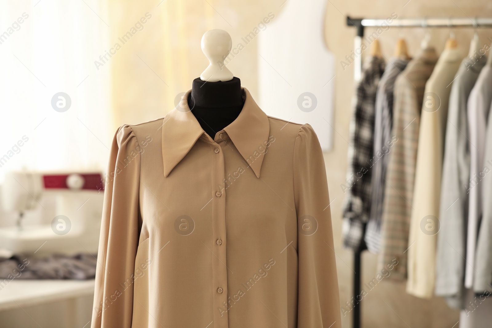 Photo of Mannequin with stylish shirt in tailor shop