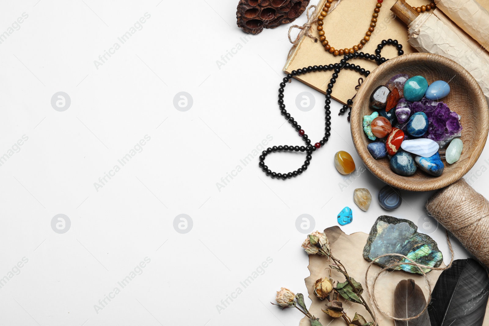 Photo of Composition with different gemstones on white background, top view