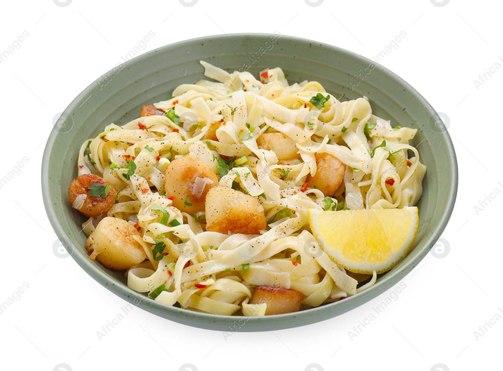Photo of Delicious scallop pasta with spices and lemon in bowl isolated on white