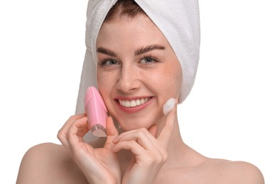 Photo of Washing face. Young woman with brush and cleansing foam on white background