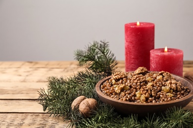 Photo of Traditional Christmas slavic dish kutia served on wooden table. Space for text