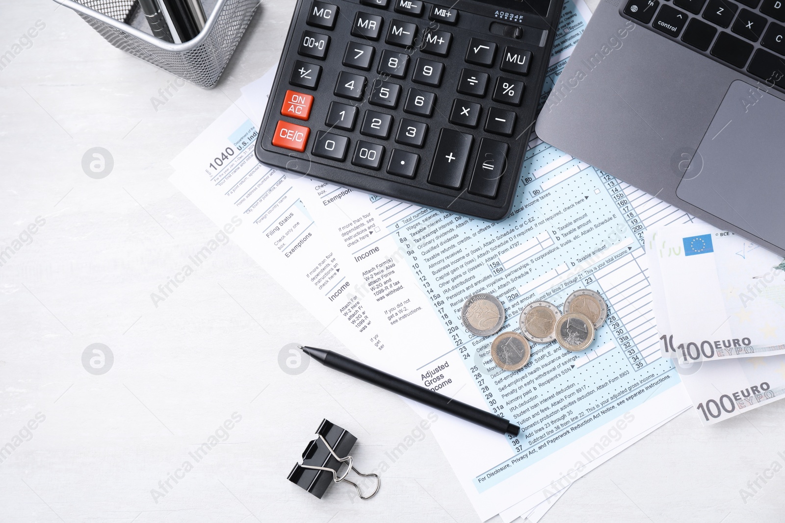 Photo of Tax accounting. Calculator, documents, money and stationery on light grey table, flat lay. Space for text