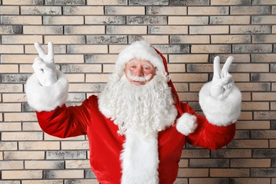 Photo of Authentic Santa Claus on brick wall background