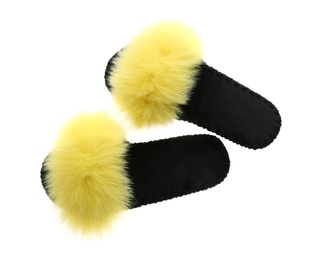 Photo of Pair of soft open toe slippers with yellow fur on white background, top view