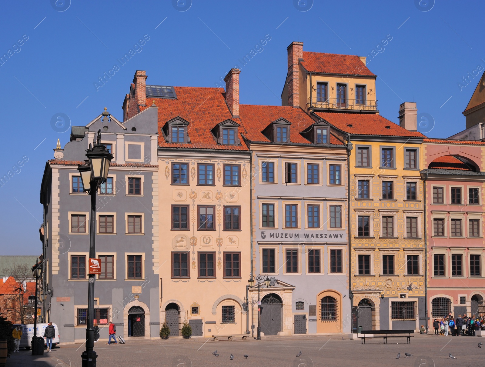 Photo of WARSAW, POLAND - MARCH 22, 2022: Beautiful view of Old Town city street on sunny day