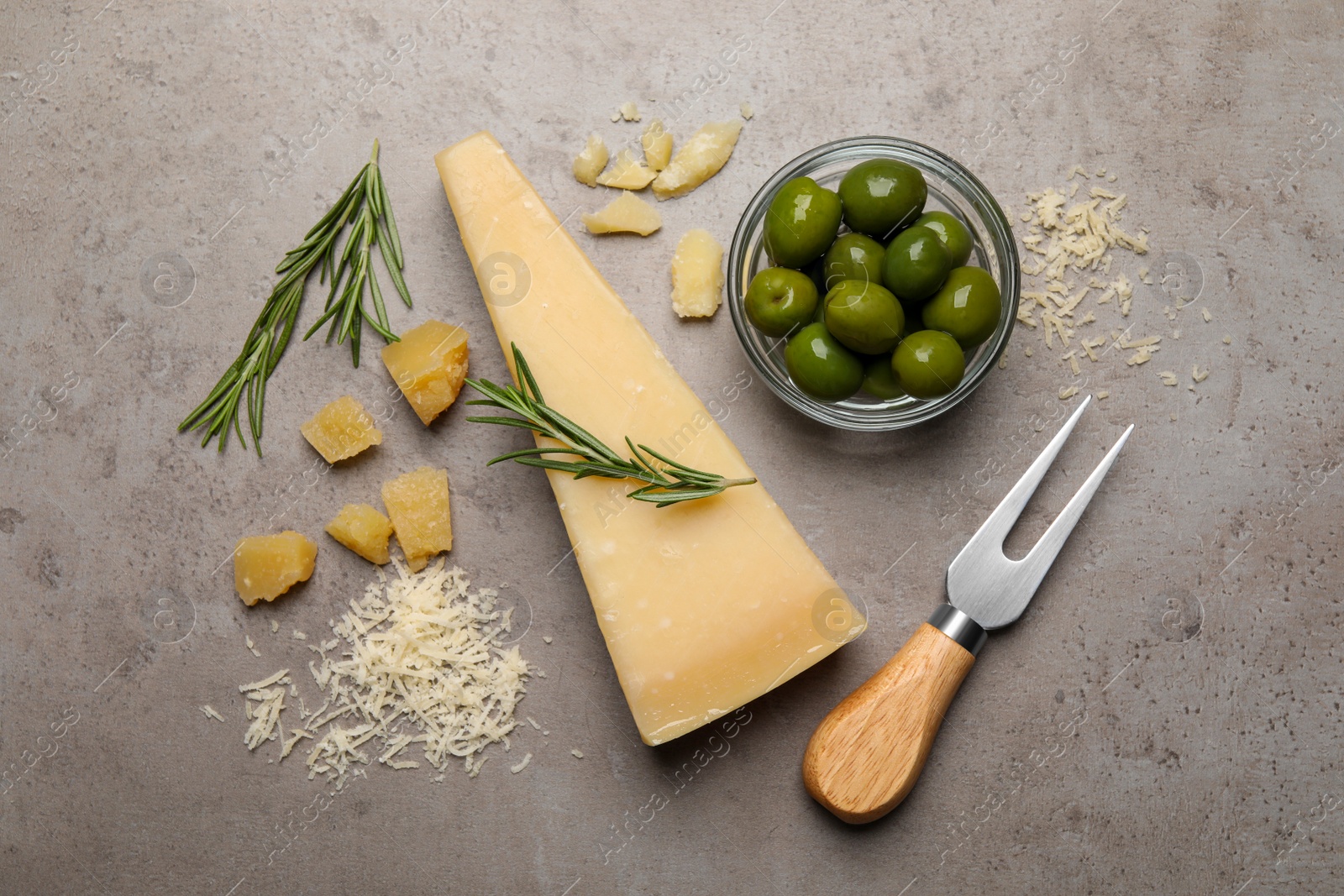 Photo of Flat lay composition with parmesan cheese on grey table