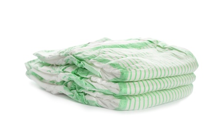 Photo of Stack of disposable diapers on white background. Baby accessories