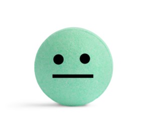 Image of Green pill with neutral face on white background