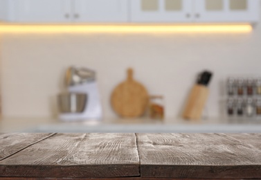 Image of Wooden table in light kitchen. Space for design