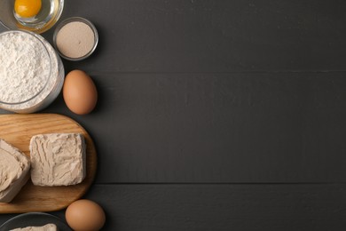 Photo of Different types of yeast, eggs and flour on grey wooden table, flat lay. Space for text