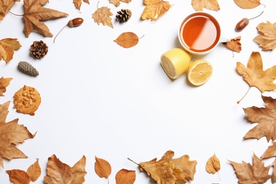 Photo of Flat lay composition with hot cozy drink and autumn leaves on white background. Space for text