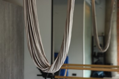 One hammock for fly yoga in studio, closeup. Space for text