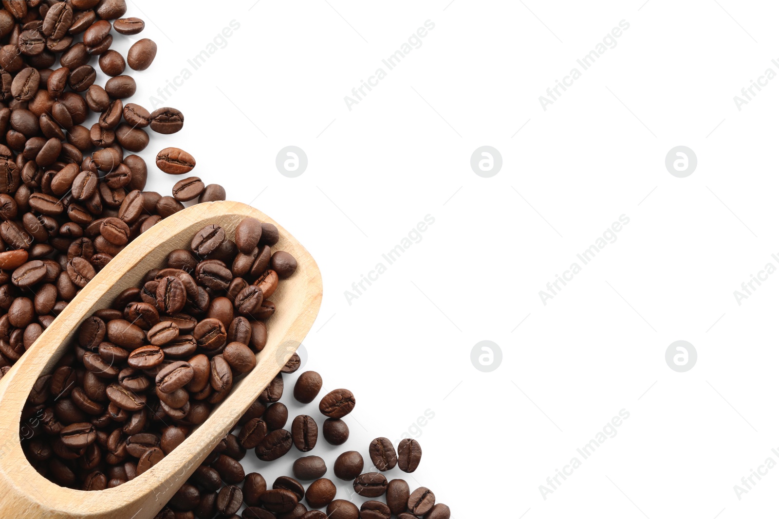 Photo of Wooden scoop with roasted coffee beans isolated on white, top view