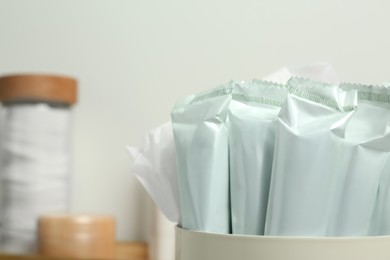 Closeup view of many tampons in holder, space for text. Menstrual hygienic product