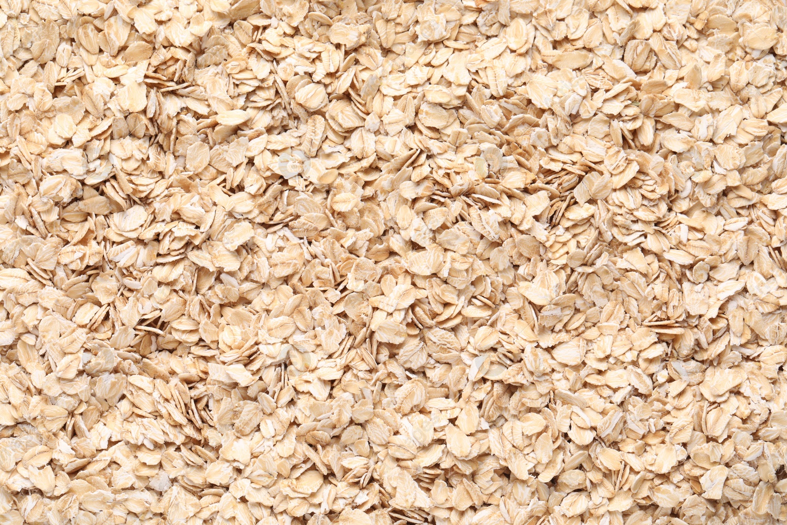 Photo of Top view of rolled oats as background