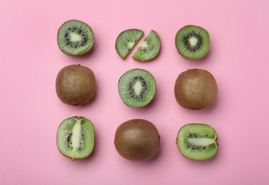 Flat lay composition with fresh ripe kiwis on pink background