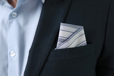 Man with handkerchief in suit pocket, closeup