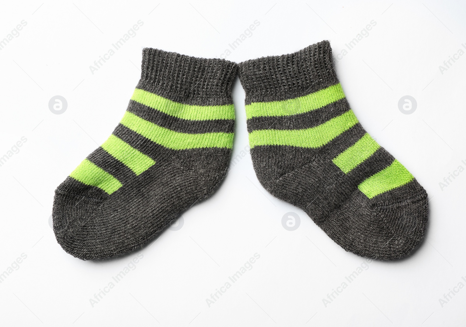 Photo of Cute child socks on white background, top view