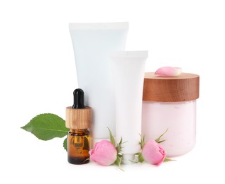 Different hand care cosmetic products and roses on white background