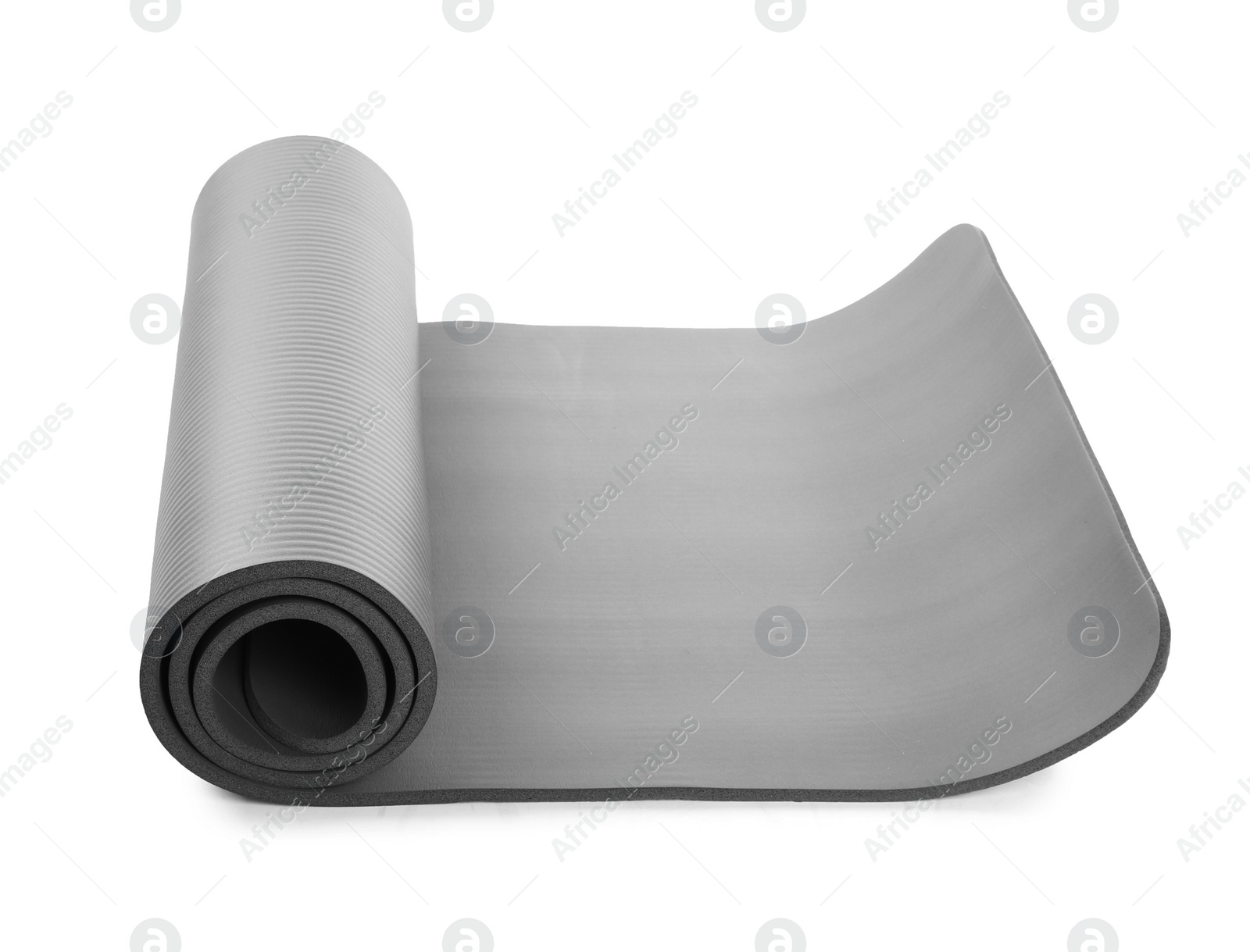 Photo of Rolled grey yoga mat on white background