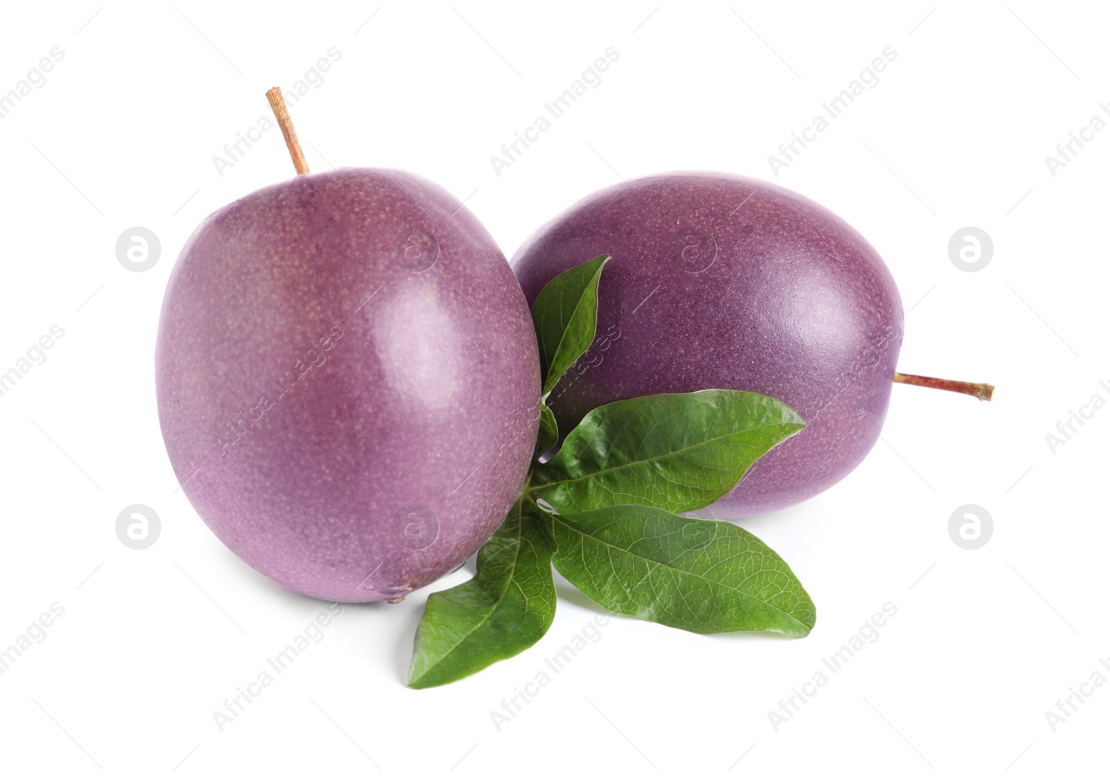 Photo of Ripe passion fruits with leaf isolated on white