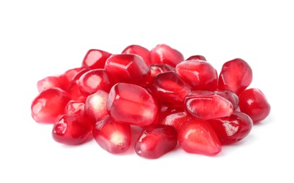 Pile of tasty pomegranate seeds on white background