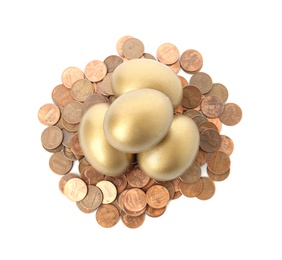 Gold eggs with coins on white background, top view