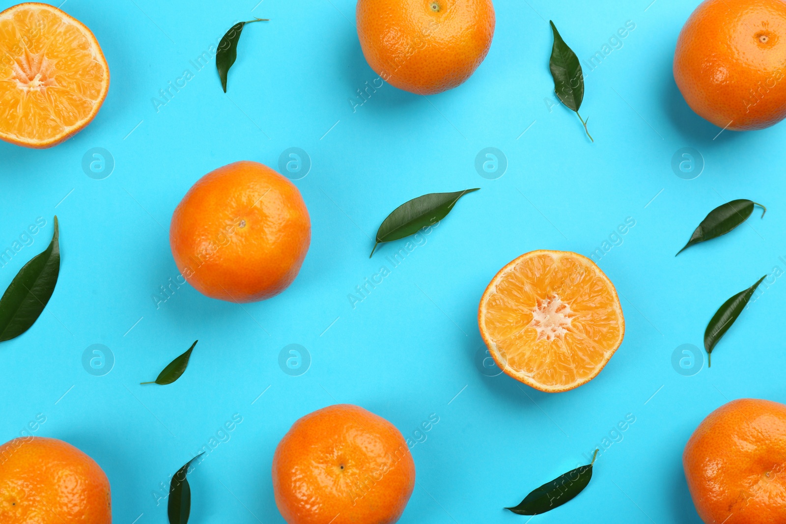 Photo of Flat lay composition with tangerines on blue background