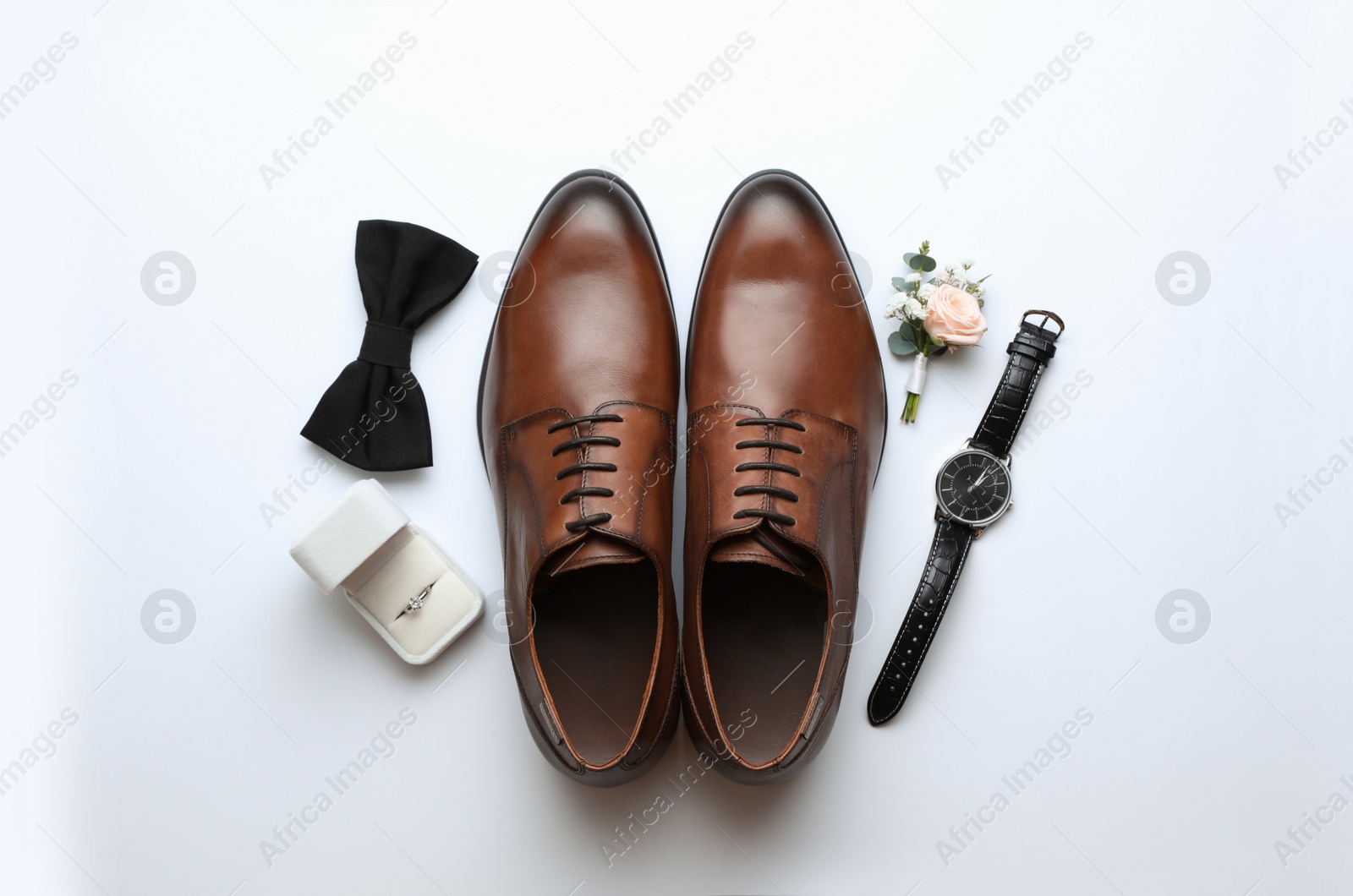 Photo of Composition with wedding shoes for groom on white background, top view