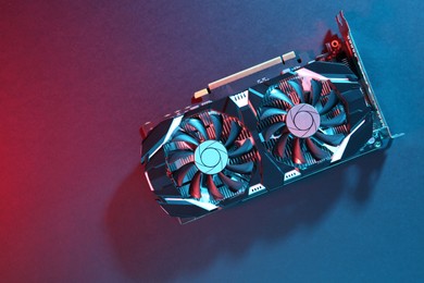 Photo of Computer graphics card on color background, top view. Space for text