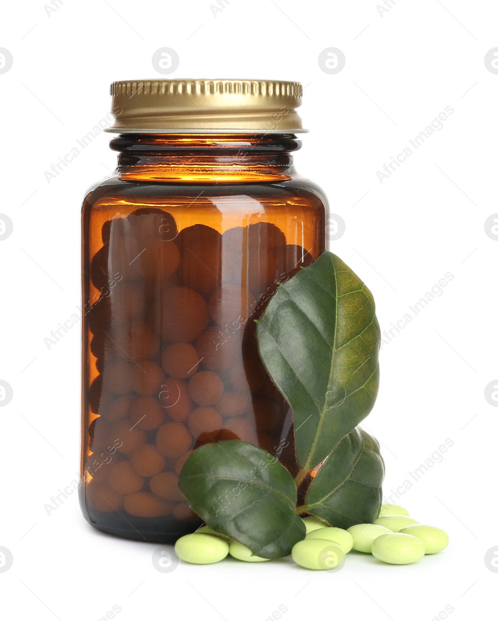 Photo of Bottle with vitamin pills and green leaves on white background