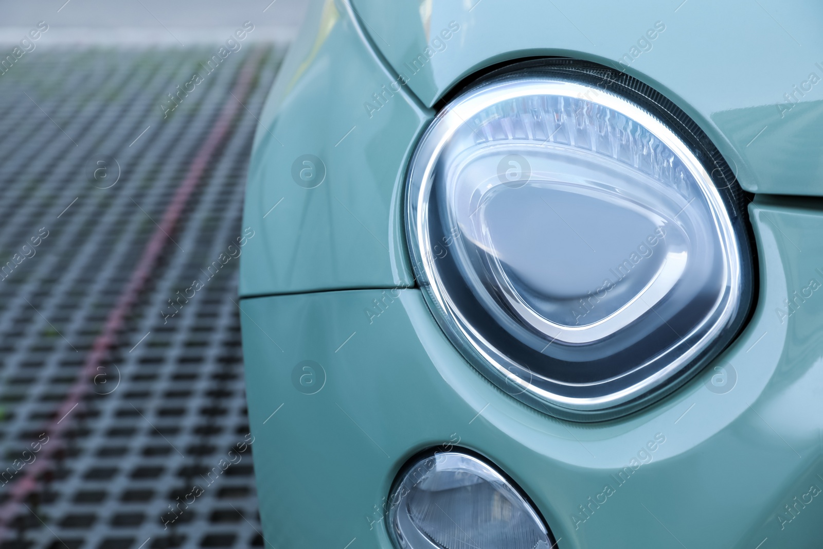 Photo of Lviv, Ukraine - May 1, 2022: Closeup view of modern Fiat 500 headlight outdoors