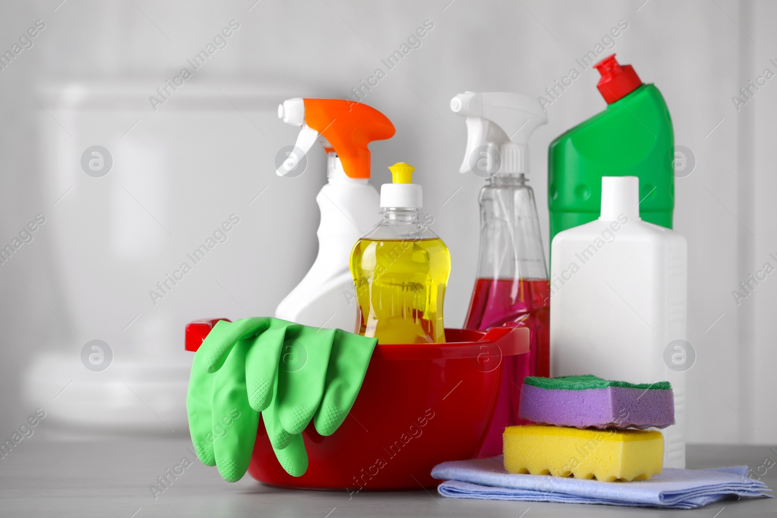 Photo of Set of cleaning supplies on table indoors