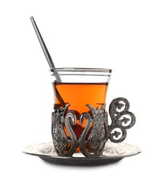 Glass of traditional Turkish tea in vintage holder isolated on white