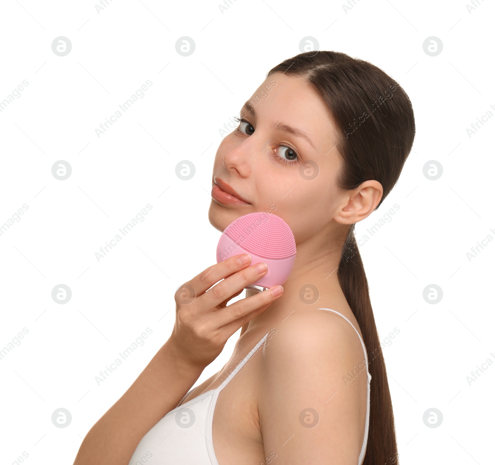 Photo of Washing face. Young woman with cleansing brush on white background