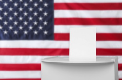 Image of Ballot box with vote against national flag of United States, space for text