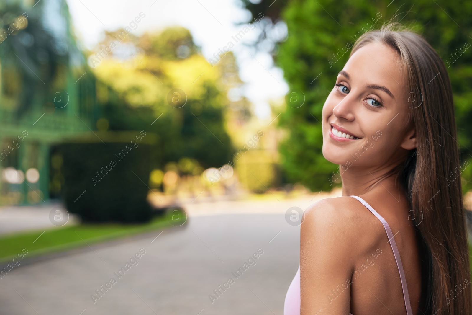 Photo of Portrait of beautiful young woman on city street, space for text